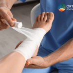 A patient at the doctor for a checkup after ankle replacement in Ohio.